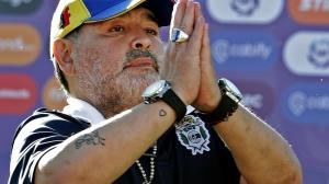 Gimnasia y Esgrima team coach Diego Armando Maradona gestures to supp