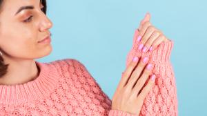 beauty-concept-pretty-woman-with-bright-pink-nail-color-manicure-on-wall