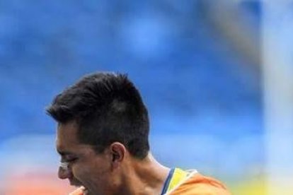 Darwin Castro, en una competencia junto a su guía, Sebastián Rosero.