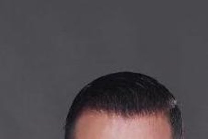 María Belén con su hermano durante una sesión fotográficas.