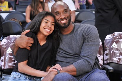 El legendario deportista junto a su hija. Ambos murieron en el accidente aviatorio hace casi un año.