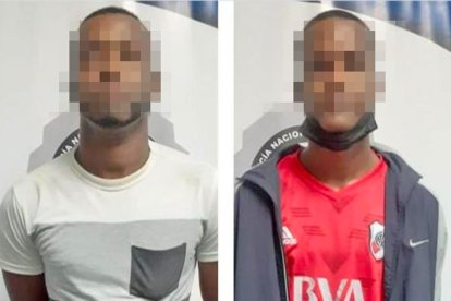 Los dos detenidos como sospechosos del crimen.