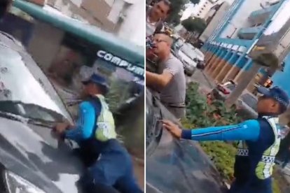 Agente de la ATM tratando de impedir que un supuesto infractor se escape.