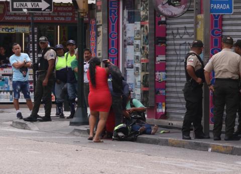 mujer baleada en el centro