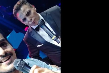 Luciano con Castro en el escenario