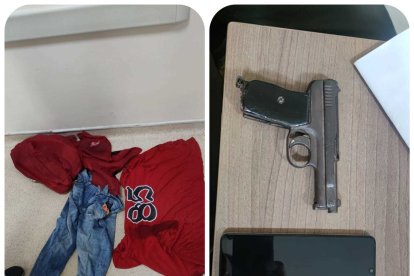 La ropa y el arma que llevaba el presunto sicario asesinado.