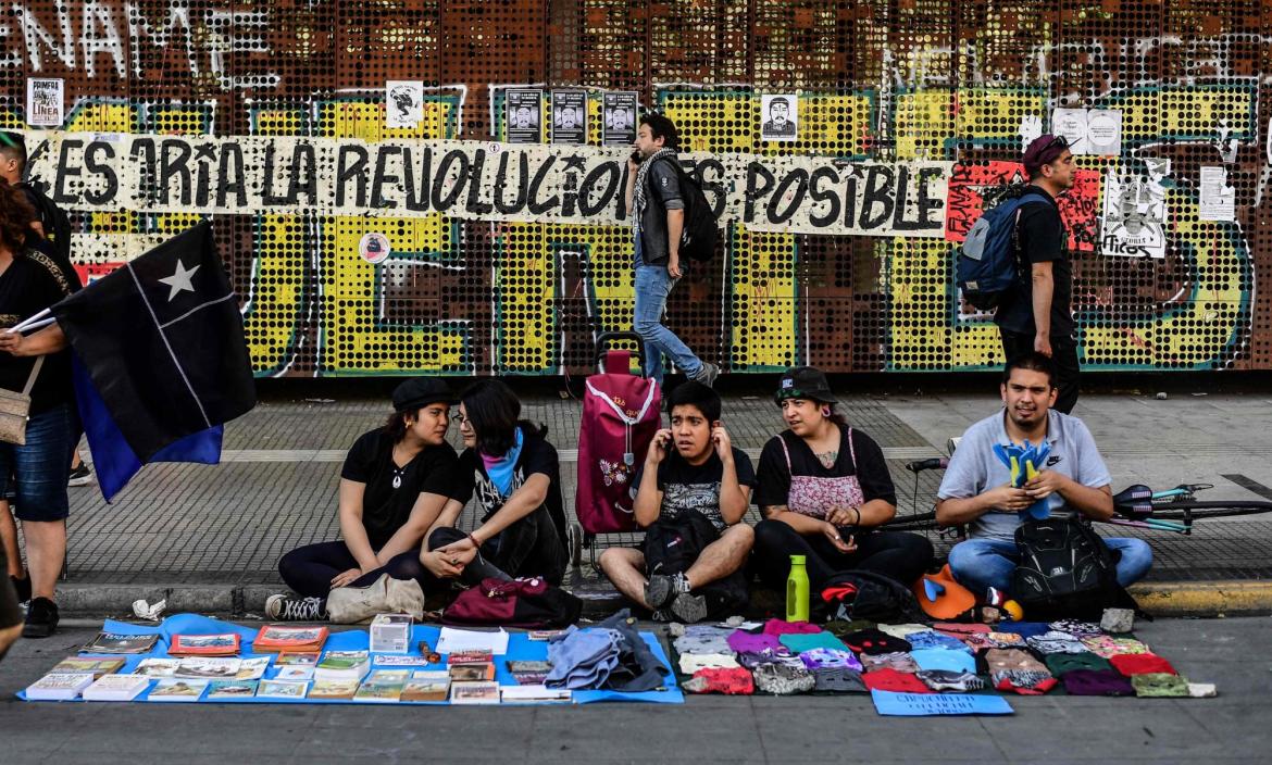 Artists sell merchandise making reference to the social crisis going