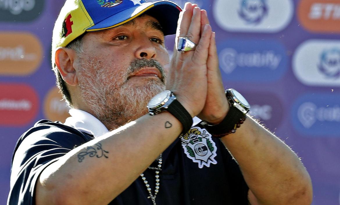 Gimnasia y Esgrima team coach Diego Armando Maradona gestures to supp