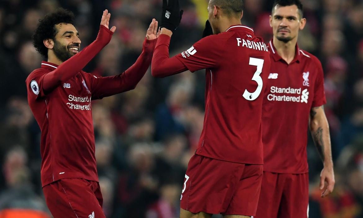 Liverpool's Brazilian midfielder Fabinho (C) celebrates with Liverpoo