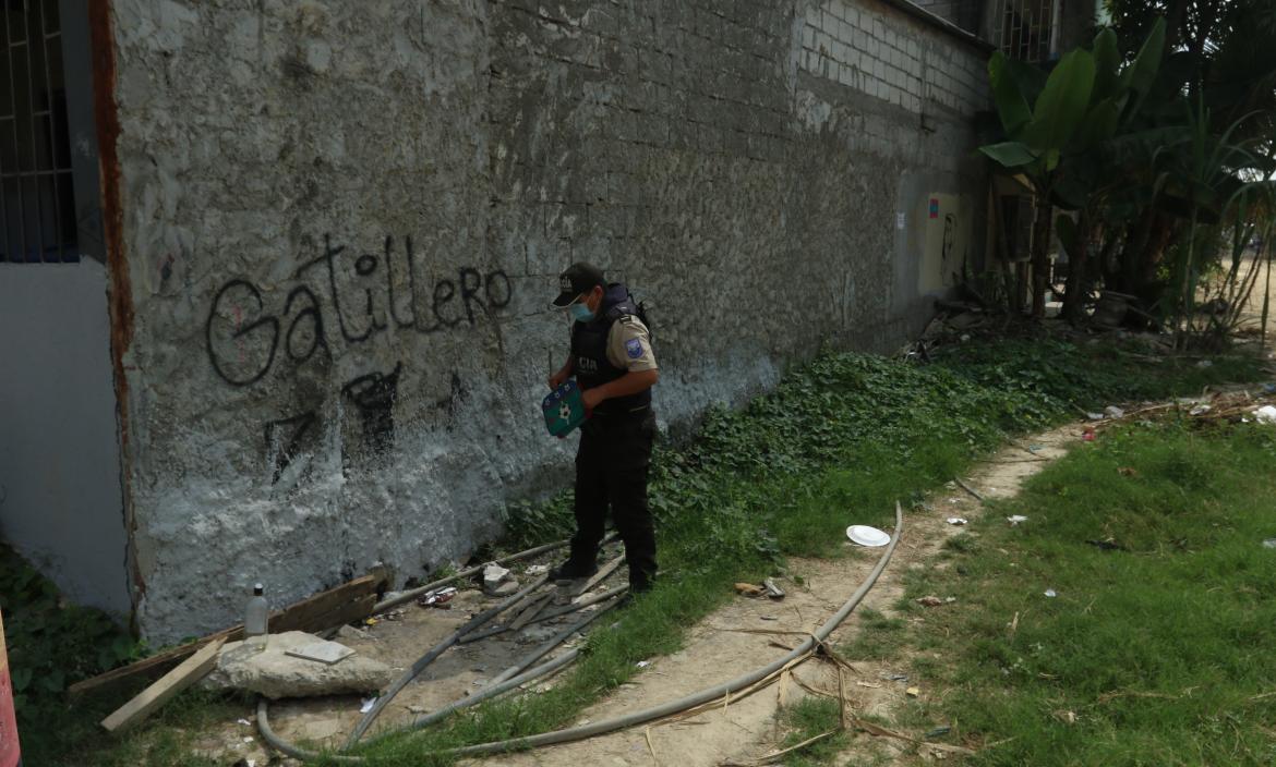 La palabra “gatillero” está escrita sobre una pared de la cooperativa 28 de Agosto. En este sector se  han registrado varias muertes violentas.