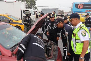 Vigilantes de la CTE se unen a controles policiales de vehículos.