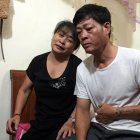  Pham Van Thin (d.) y Nguyen Thi Phong, padres de una las víctimas del camión frigorífico. 