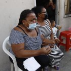 La madre de la víctima dijo que su hijo estaba comprando en el instante del crimen.