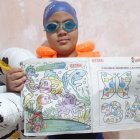 Álex Bajaña, de 8 años, ganó con Colorito una orden de compra en útiles escolares por pintar el fondo marino.