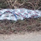 Aún no se conoce la identidad de la víctima envuelta en una sábana.