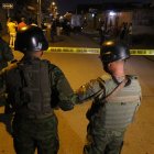 Policias y militares acordonaron la escena del multiple crimen.