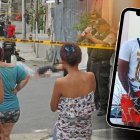 En este auto negro llevaban a la víctima. A un costado, agentes de Criminalística realizaban pericias cerca del cadáver.