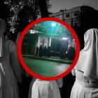 Captura de pantalla que muestra a los extraños visitantes a las afueras del cementerio.