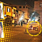 Un morador coloca velas en el lugar donde fueron baleados los jóvenes, quienes murieron en una casa de salud.