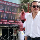 Daniel Noboa (d), presidente del Ecuador, y una de las vallas con las caras de jueces de la Corte Constitucional.