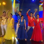 Kimberly (amarillo) con el elenco de baile del programa de TC Televisión.