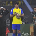 Riyadh (Saudi Arabia), 03/01/2023.- Portuguese soccer player Cristiano Ronaldo signs a soccer ball at Mrsool Park stadium during a presenting ceremony, in Riyadh, Saudi Arabia, 03 January 2023. Cristiano Ronaldo will be presented at Mrsool Park stadium on 03 January after he signed a contract for Al-Nassr FC untill 2025. (Arabia Saudita) EFE/EPA/STR