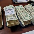 Entre las evidencias se hallaron armas y dinero en efectivo.