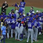 La selección de Venezuela celebra tras el último out que le dio la victoria en la final del Clásico Mundial de Béisbol 2026.